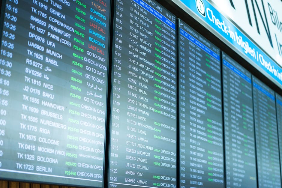 airport departure board with flight times