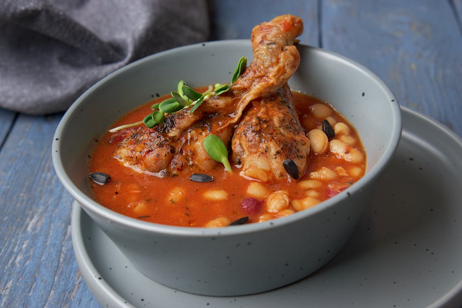 Asturian fabada bean stew in rustic ceramic bowl