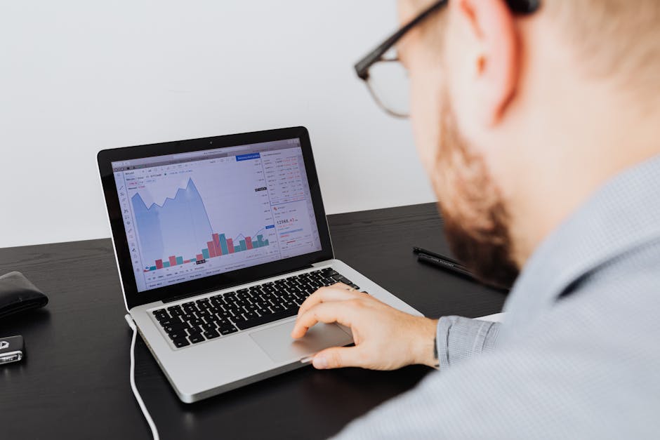 business owner analyzing data on laptop