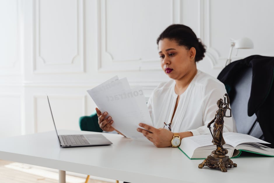 business professional reading labor law documents