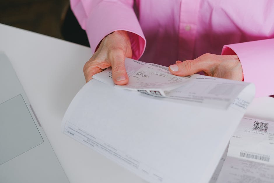 businesswoman reviewing invoices at bright office