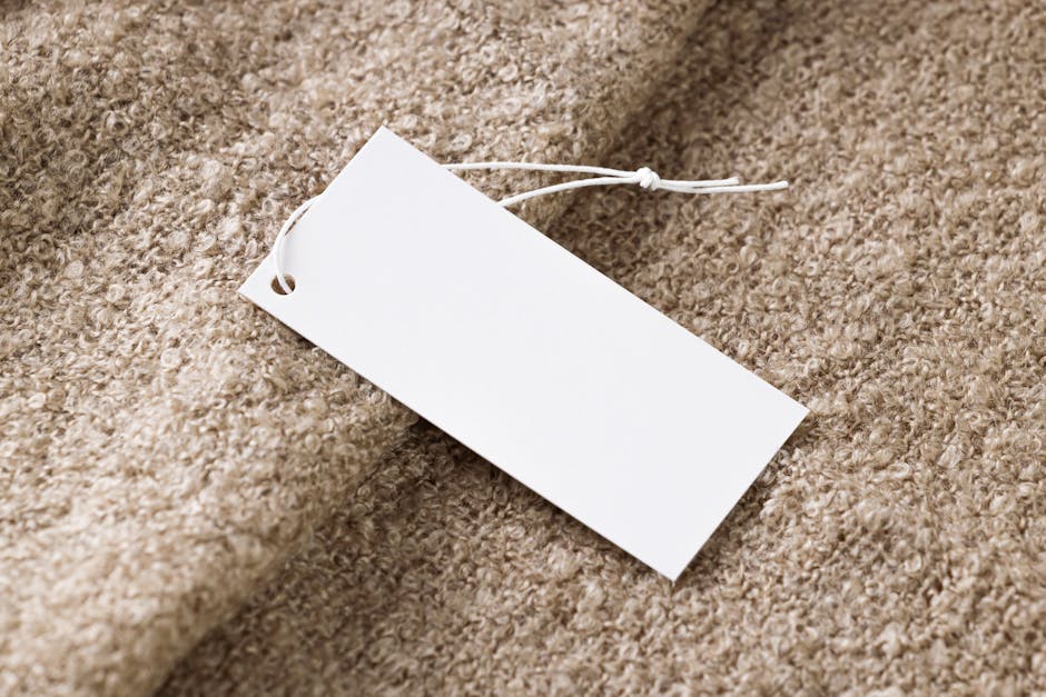 close up of clothing price tags and fabric tags