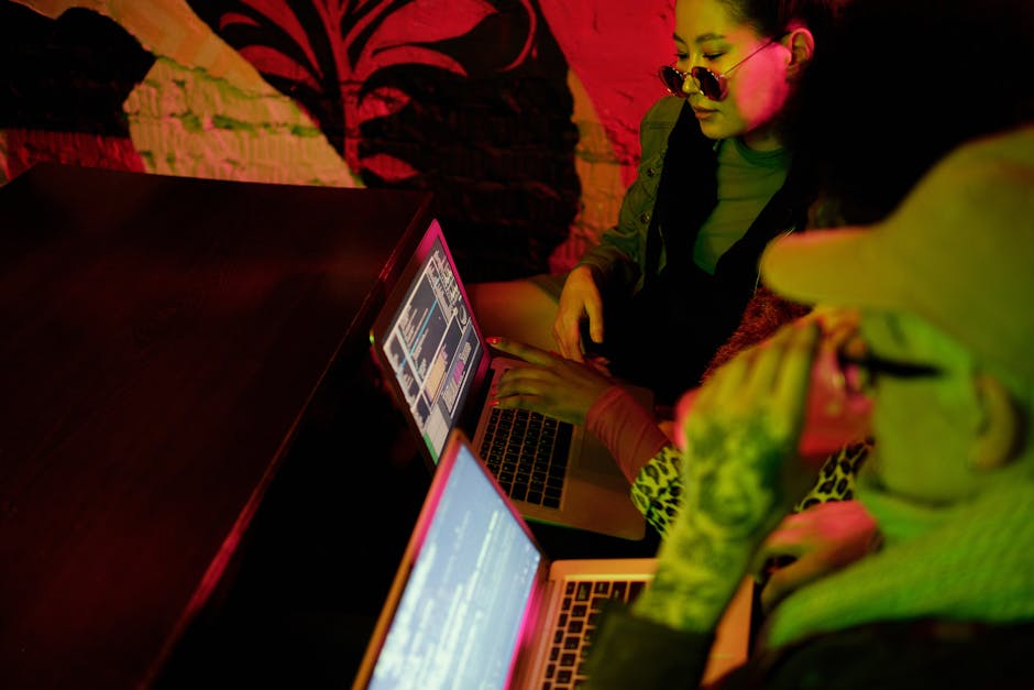 coding meetup evening discussion with laptops