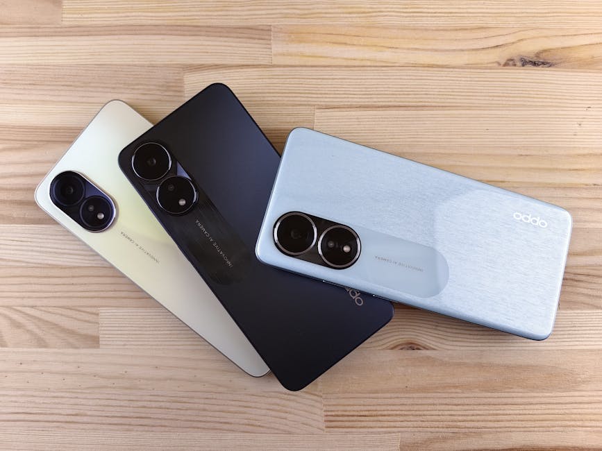 collection of different smartphones on wooden table