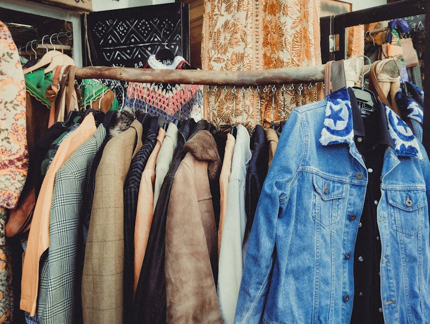 colorful second-hand clothing rack in French vintage boutique