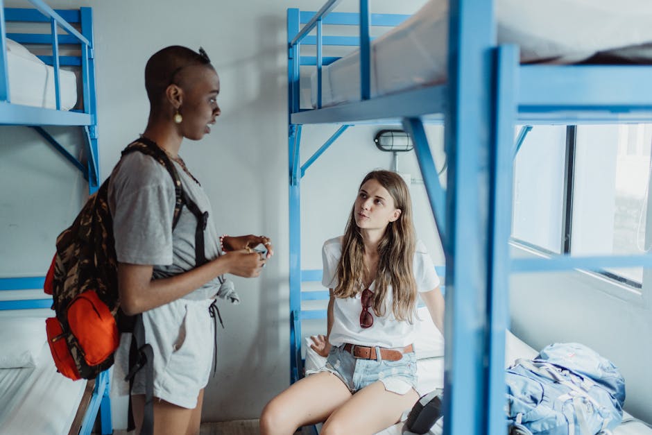 cozy hostel dormitory with bunk beds and backpack