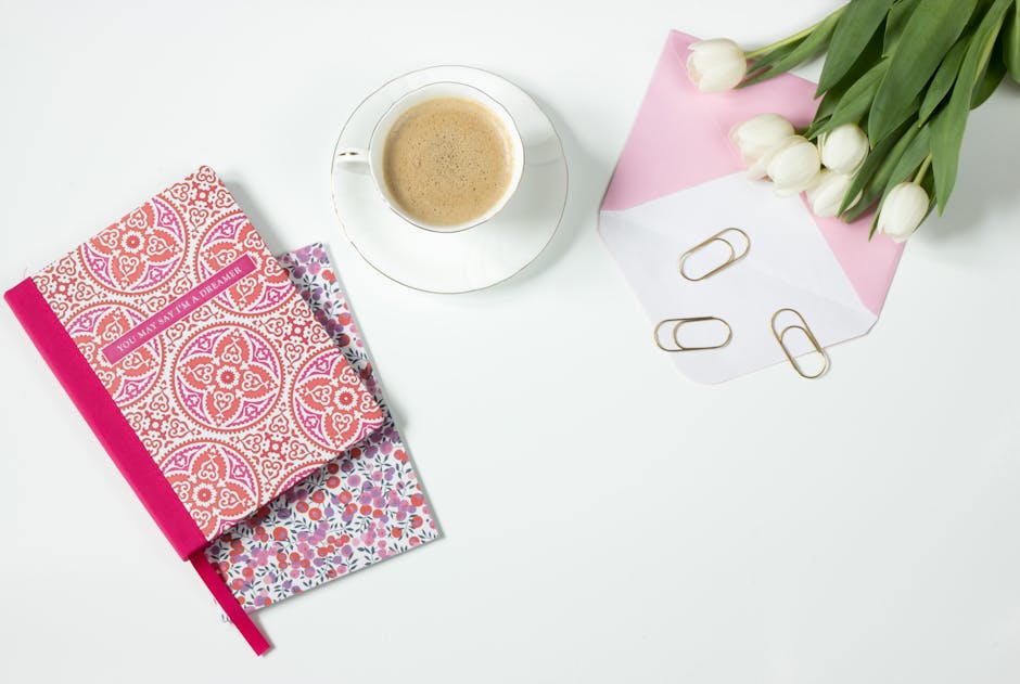 creative workspace desk with coffee and notebook