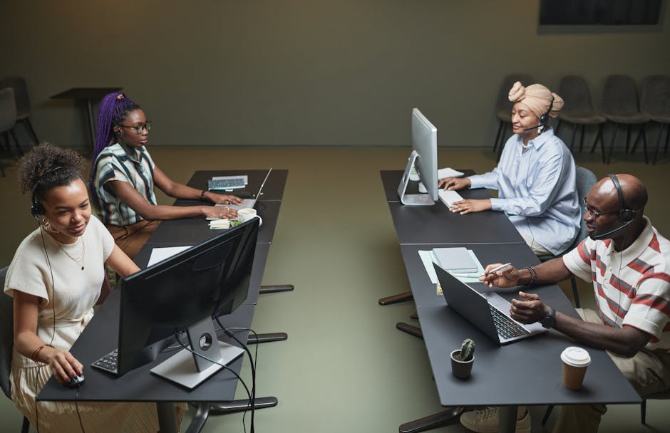 diverse professionals working at computer monitors with German city skyline visible
