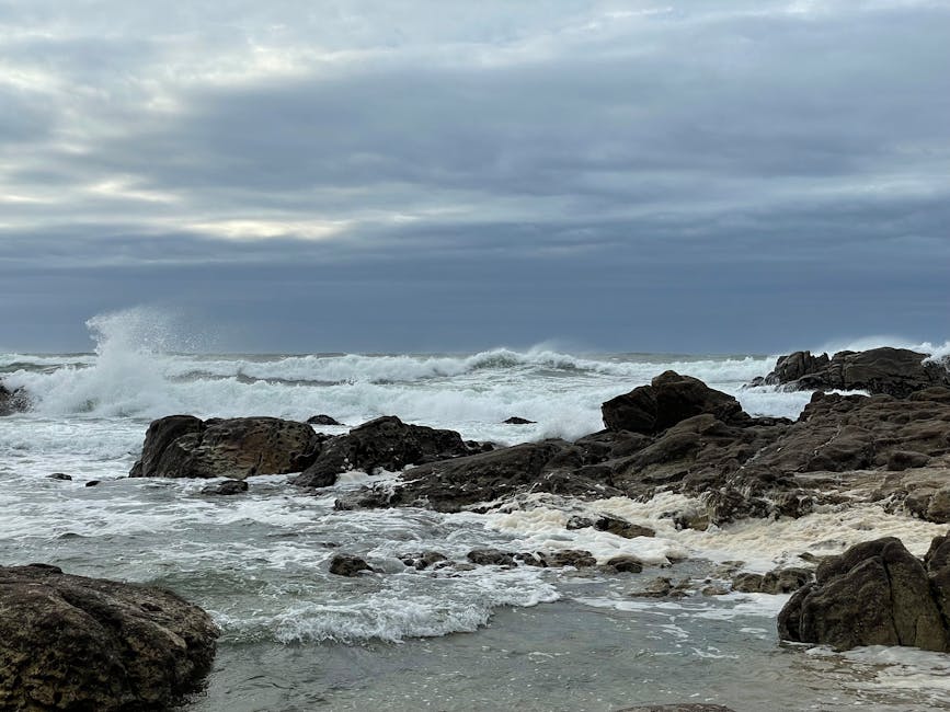 dramatic rocky coastline with waves crashing