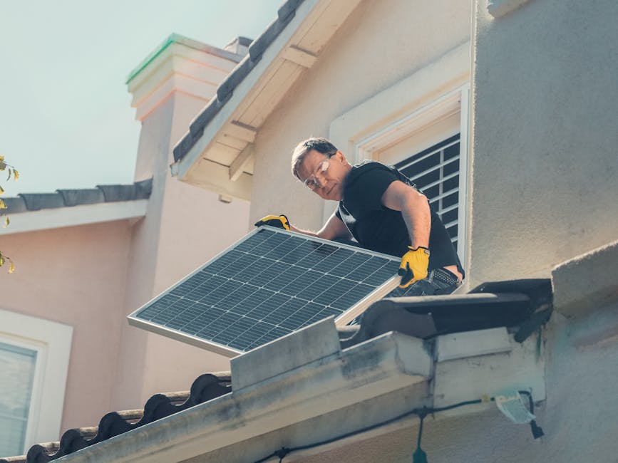 electrician installing solar panel on residential roof