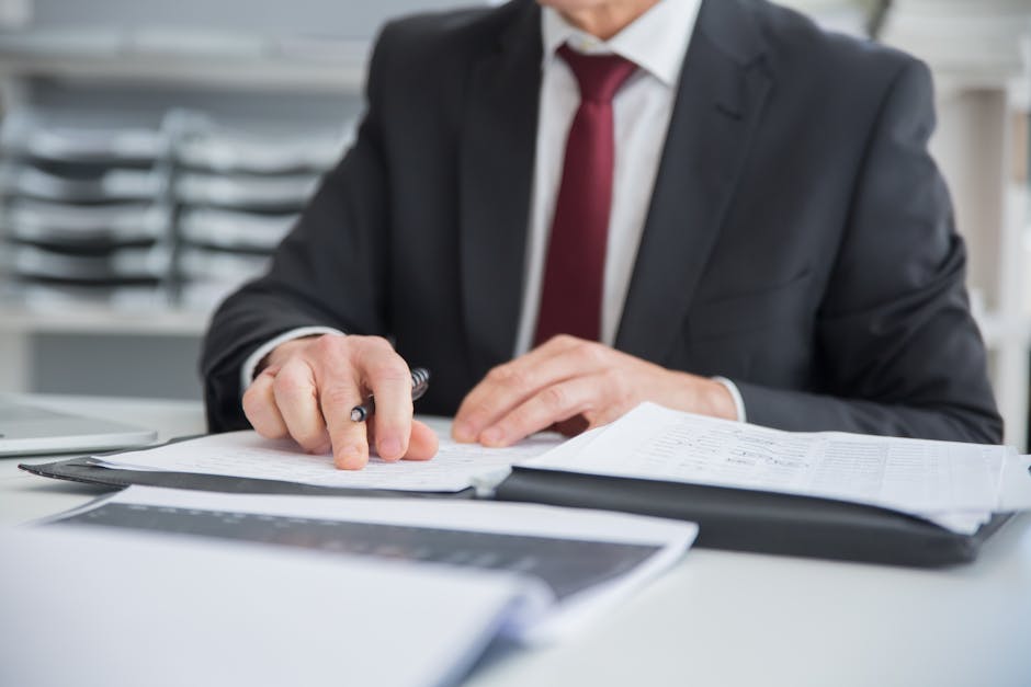 entrepreneur reviewing business registration documents at desk