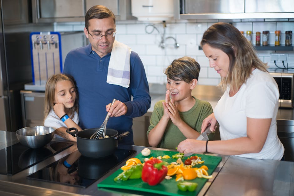 family cooking fresh vegetables in modern kitchen
