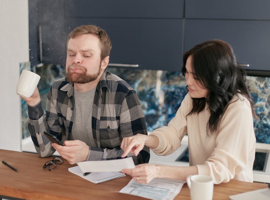 family reviewing electricity bill at kitchen table