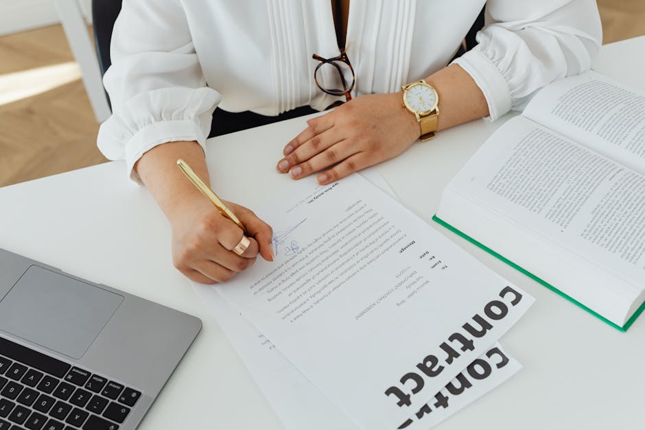 french businesswoman signing contract at cafe