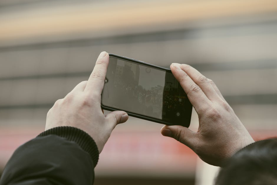 French consumer testing phone screen outdoors
