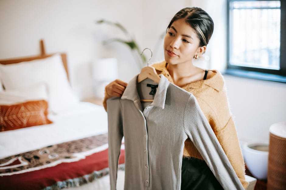 french woman styling capsule wardrobe in bedroom