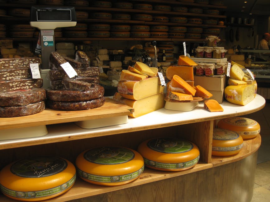 Fromagerie counter with wheels of cheese