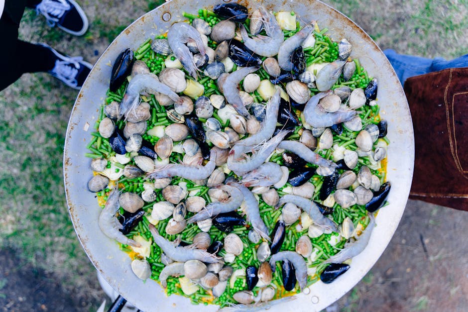 golden paella with socarrat crust in pan