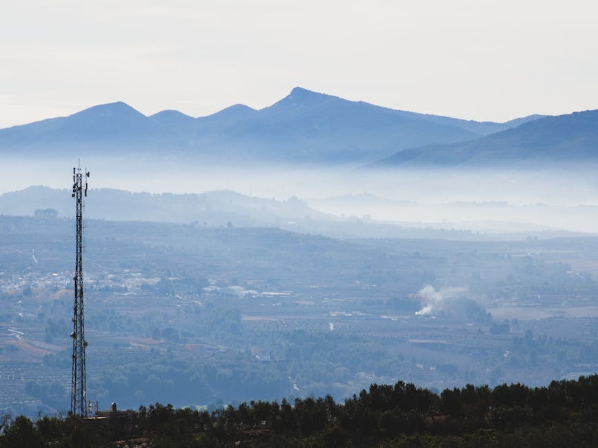 green Spanish countryside with telecommunications mast