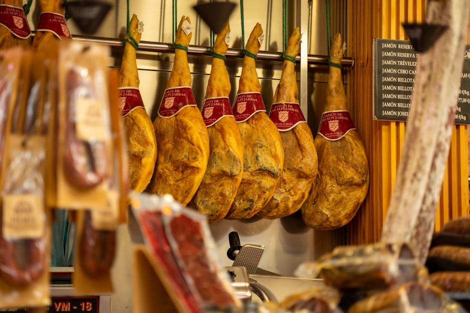 hanging cured ham in traditional cellar