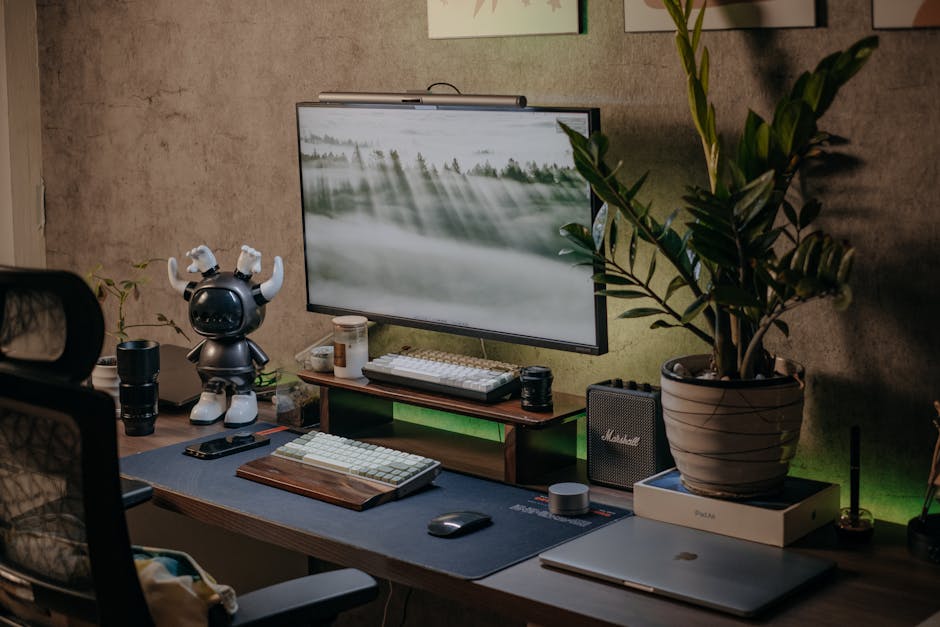 home office setup with external monitor and plants