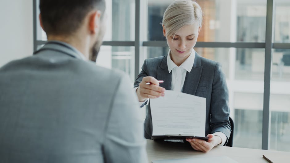 human resources manager reviewing employment contracts