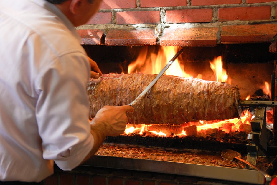 kebab meat slicing from vertical rotisserie spit