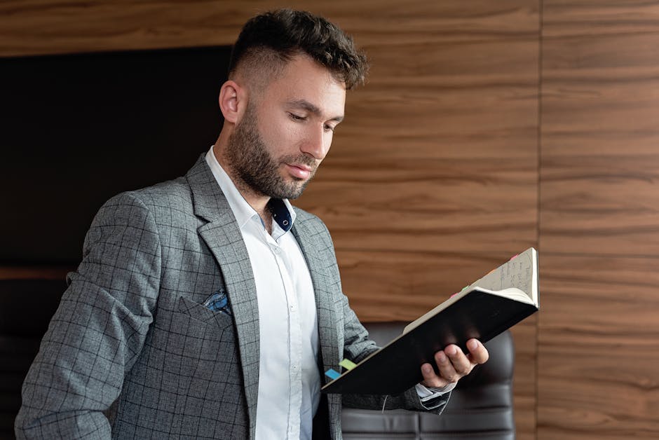 man in casual smart blazer working at desk