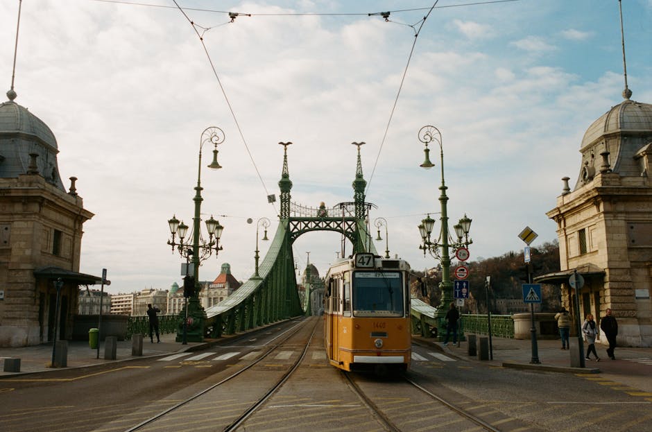 Old wooden tram on Krakow streets crossing historic bridge
