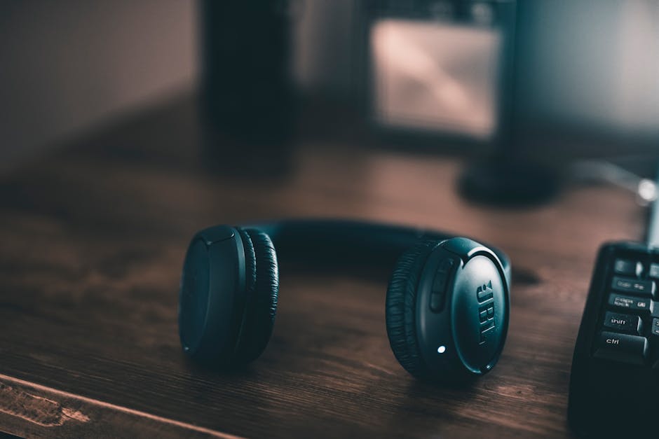 over-ear headphones on wooden desk