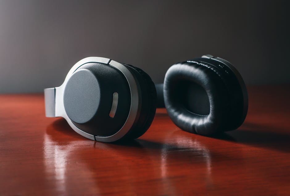 over-ear headphones on wooden table with city view