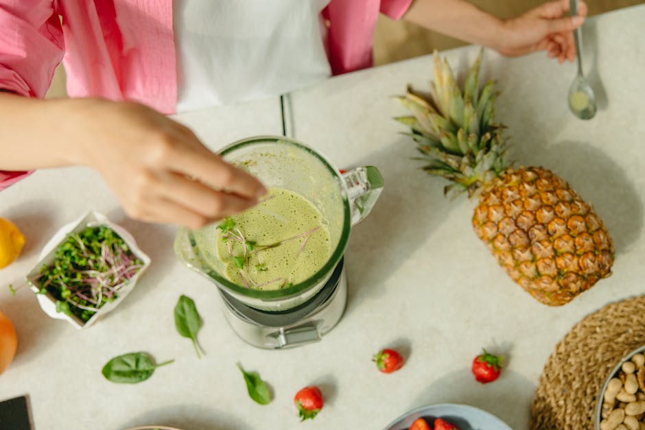 person blending fresh acai puree in kitchen with natural ingredients