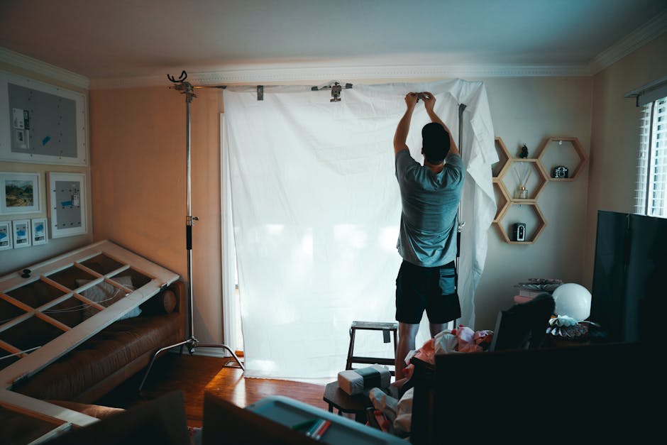 person installing wifi camera in living room
