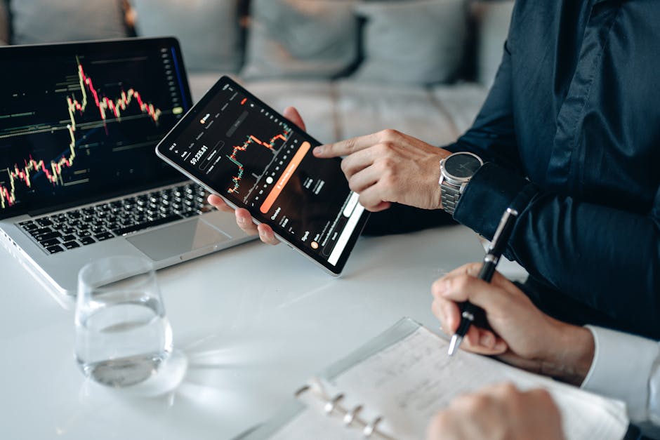 Person reviewing financial data on tablet screen
