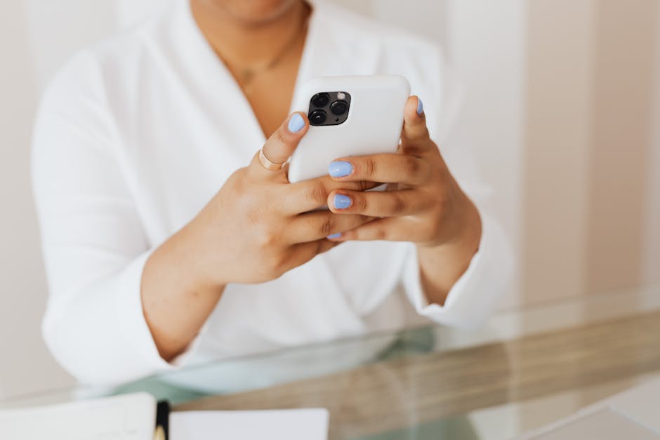 person typing on smartphone with business notification showing