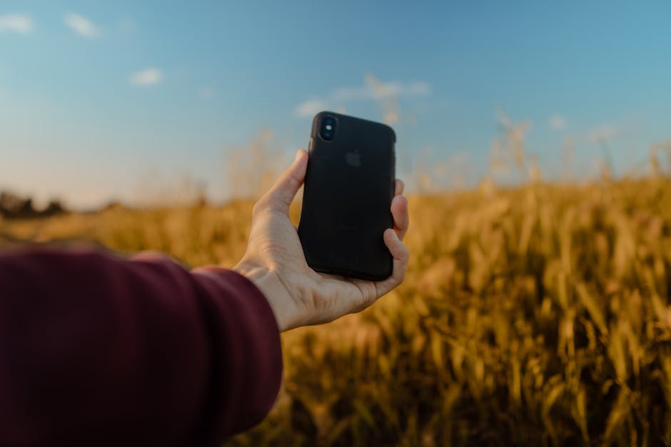person using smartphone rural France