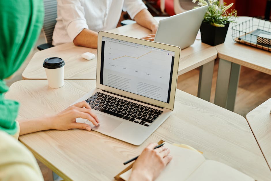 person working at modern coworking space with laptop
