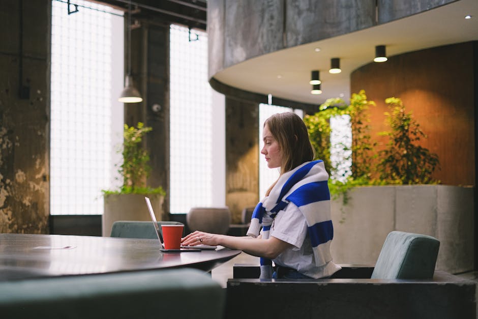 polish entrepreneur working on laptop in co-working space