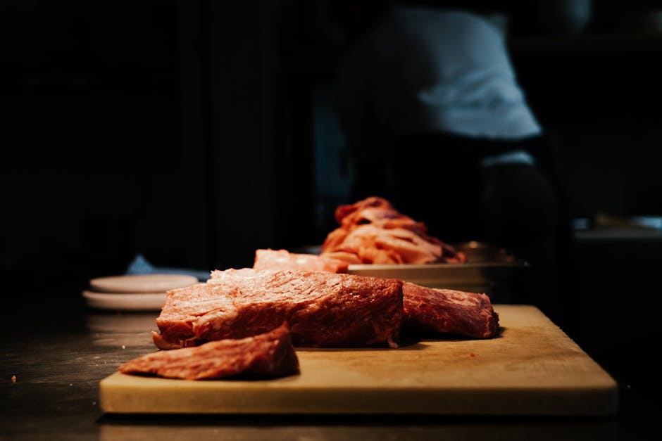 raw meat cuts on wooden board
