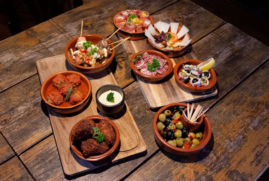 Seafood tapas plates on wooden board