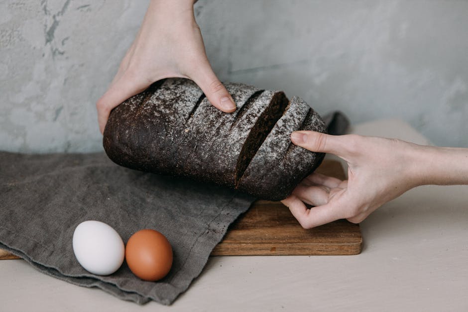 sliced dark rye bread rustic table