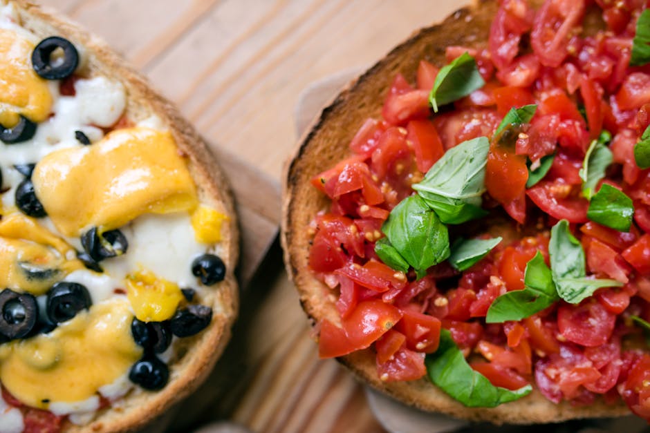 sliced ripe tomato being rubbed on toasted bread in Spain