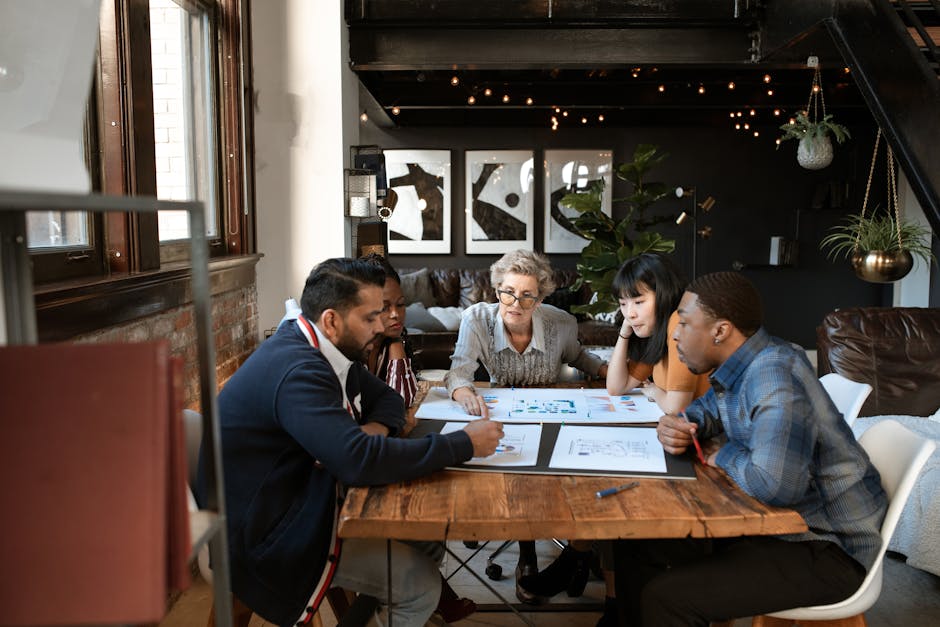small team discussing IT security strategy in modern office