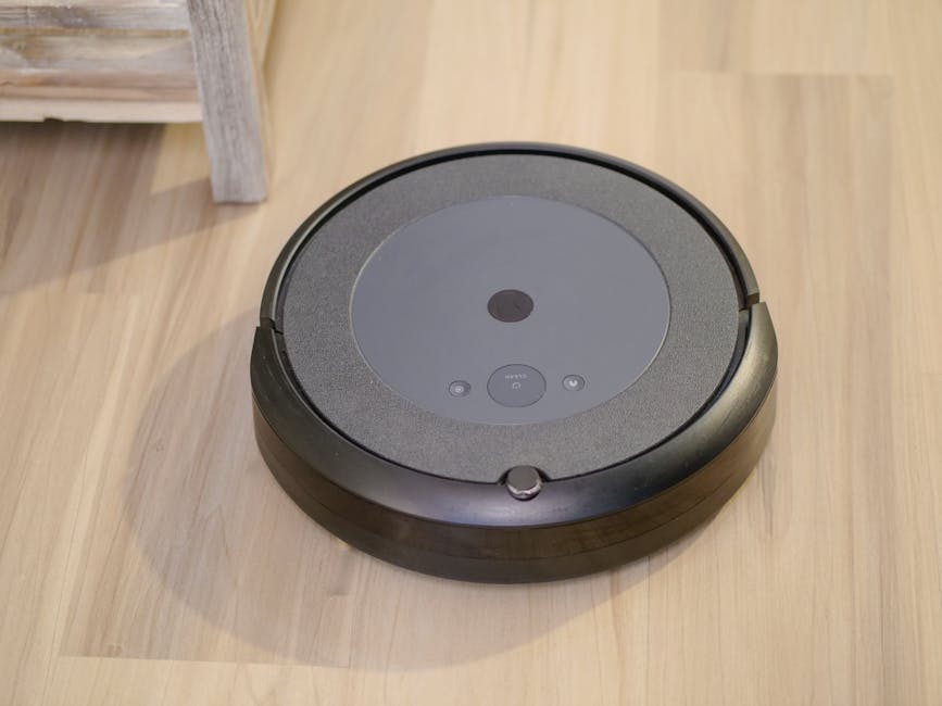 smart robot vacuum on wooden floor