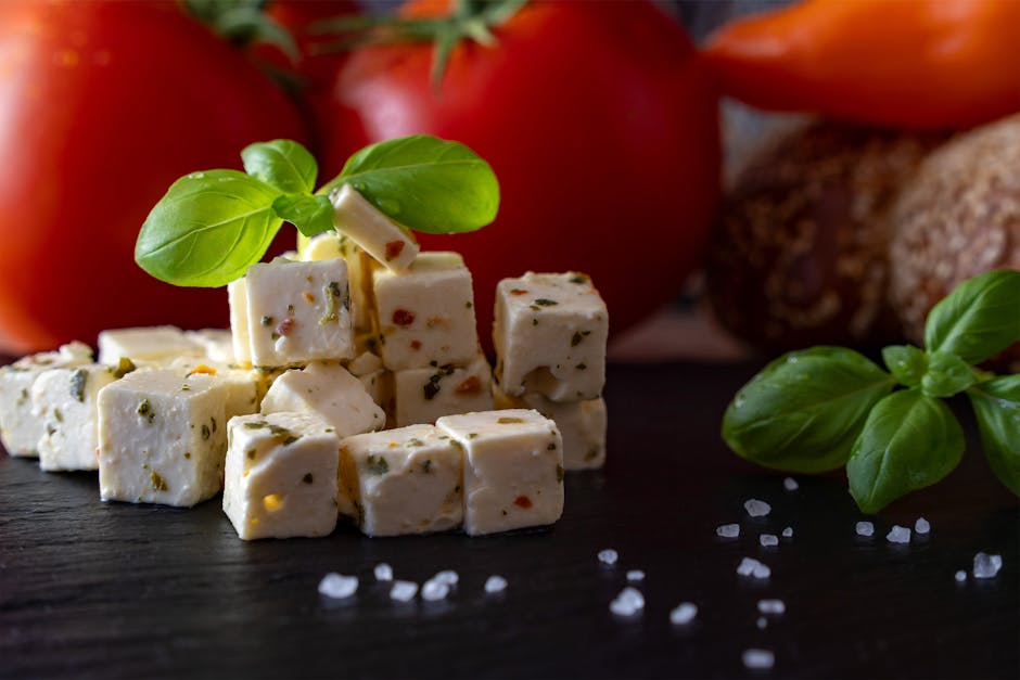 smoked sheep cheese on wooden board with spices