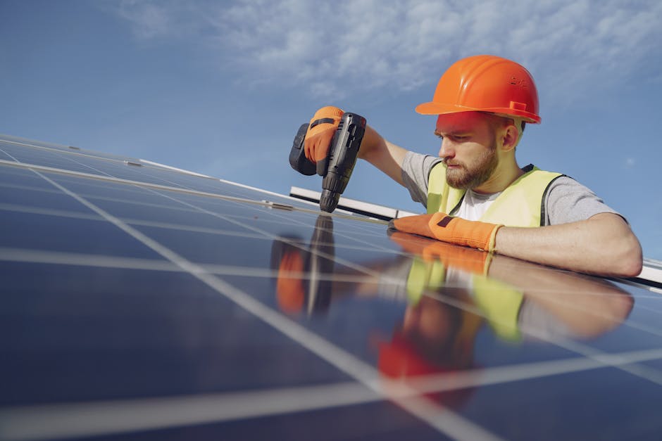 solar installer worker on rooftop with panels