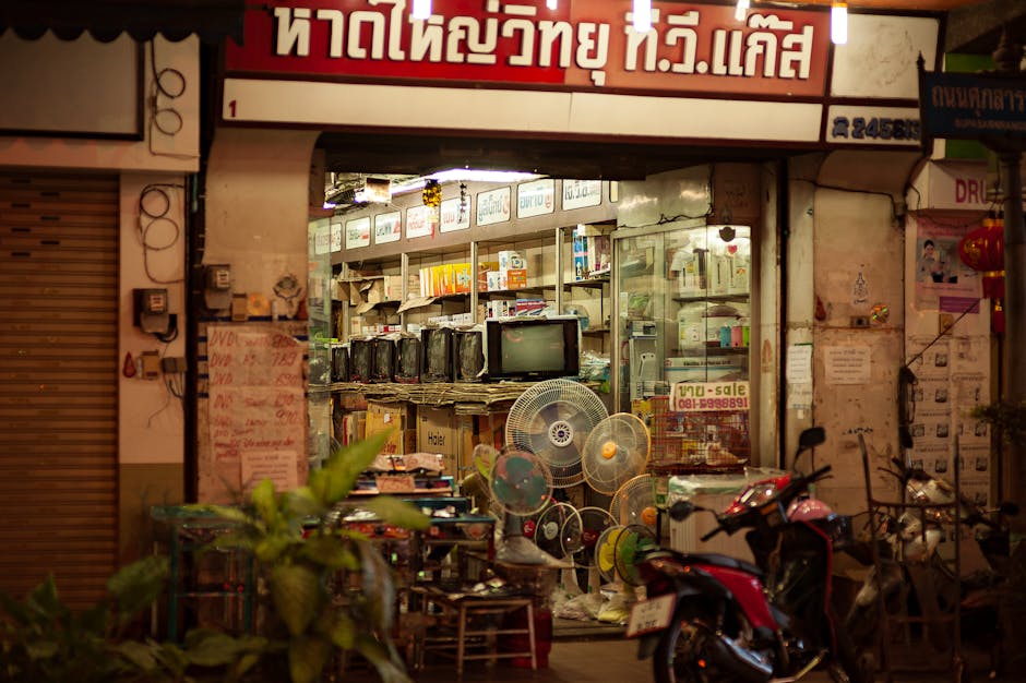 street with electronics shops at night