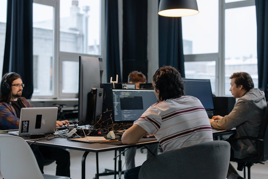 team programmers collaborating in modern office