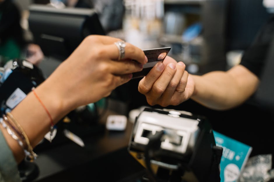 tourist paying with credit card at electronics checkout