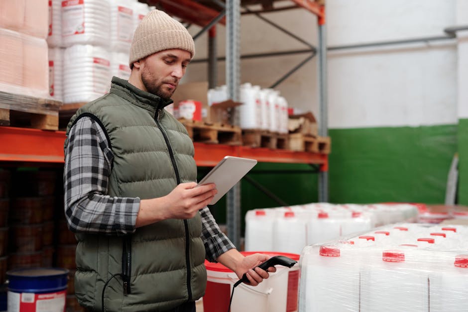 warehouse worker scanning packages with barcode scanner